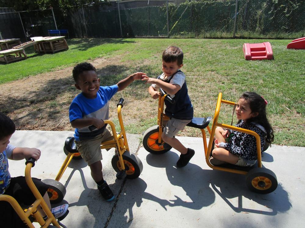 Children on tricycles